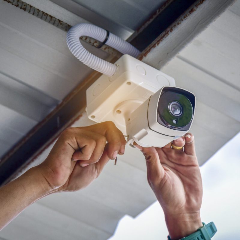 Technician installing CCTV camera system for security area